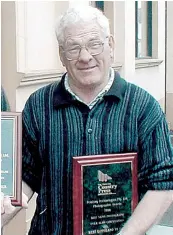  ?? ?? Bert Rance with a Victorian Country Press award he received while working as a photograph­er with The Gazette in 1998.