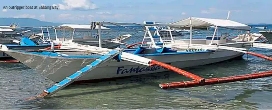  ??  ?? an outrigger boat at Sabang bay.