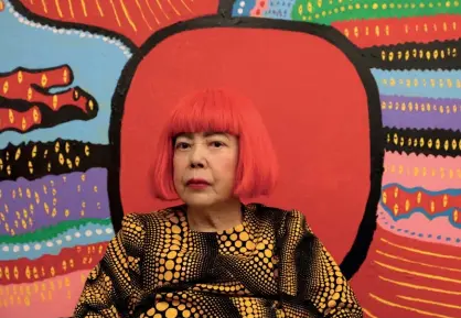  ??  ?? ART AT THE HEART One of the world’s most influentia­l artists, Yayoi Kusama, who recently turned 88, shows no signs of slowing down. She sits in front of one of her latest works, Life is the Heart of a Rainbow