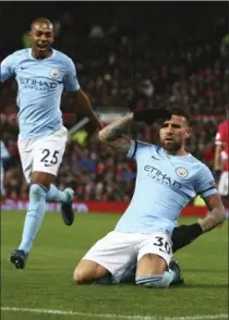  ?? DAVE THOMPSON, THE ASSOCIATED PRESS ?? Manchester City’s Nicolas Otamendi salutes after scoring his side’s second goal against Manchester United at Old Trafford Stadium in Manchester, England, on Sunday. City won the Manchester derby, 2-1.