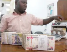  ?? — Reuters ?? A money dealer counts the Nigerian naira on a machine in his office in the commercial capital of Lagos.