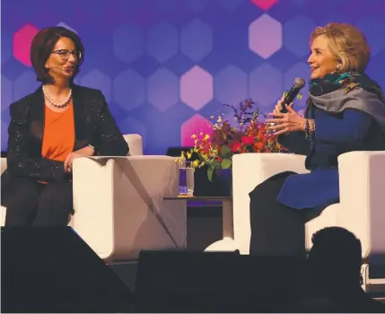  ??  ?? ROLE MODEL: Hillary Rodham Clinton speaks with Julia Gillard at their event in Melbourne.