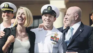  ?? Sandy Huffaker Getty Images ?? NAVY SEAL Edward Gallagher, center, and wife Andrea celebrate July 2 after he was acquitted of murder.