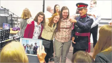  ??  ?? Square Pegs members Abigail Macgregor, Sarah Williams and Yasmin Bishop get their picture taken with Vice Lord-lieutenant of Kent Richard Oldfield