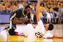  ??  ?? The Golden State Warriors’ Draymond Green has words with the New Orleans Pelicans’ Anthony Davis during the third quarter of Tuesday night’s game.