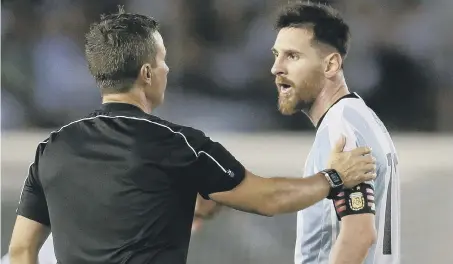  ??  ?? Argentina’s Lionel Messi argues with assistant referee Emerson Augusto de Carvalho during a World Cup qualifying match between Argentina and Chile last Thursday. Messi has been banned for four internatio­nal matches for abusing the official.