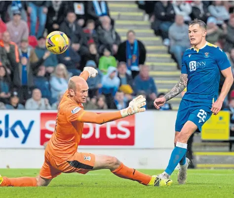  ?? ?? Callum Hendry sends a chipped effort past ICT keeper Mark Ridgers to put Saints three goals ahead.