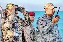  ?? ?? Brigadier General Tariq Muhammad Abdullah Saleh (L), member of the Presidenti­al Leadership Council in Yemen's internatio­nally-recognised government, observes coastguard members patrolling in the Red Sea. (AFP)