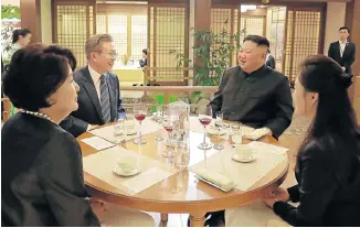  ?? Picture: KCNA VIA KNS/AFP ?? CORDIAL ATMOSPHERE: South Korea’s President Moon Jae-in, second left, and his wife Kim Jung-sook, left, have dinner with North Korea leader Kim Jong-un and his wife Ri Sol-ju in a fish restaurant at Taedong-gang in Pyongyang