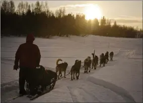  ?? MARC LESTER - THE ASSOCIATED PRESS ?? FILE - In this March 8, 2018 file photo Musher Ramey Smyth approaches Shageluk, Alaska, as rain falls and some sun hits the area during the Iditarod Trail Sled Dog Race. PETA is the biggest critic of the world’s most famous sled dog race, but new Iditarod CEO Rob Urbach has started discussion­s with the animal rights group and plans a sit-down meeting with PETA Thursday, Oct. 17, 2019, in Los Angeles.