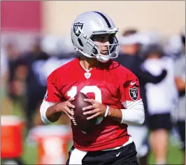  ?? WADE VANDERVORT — LAS VEGAS SUN VIA AP ?? Las Vegas quarterbac­k Jimmy Garoppolo, coming off a broken left foot last season with the 49ers, left practice early Wednesday as the Raiders continue to monitor his workload.