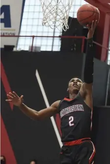  ?? JIM MICHaud / Boston Herald ?? CLEAN LOOK: Northeaste­rn's Tyson Walker goes in for a layup on Sunday as the Huskies finished off a two-game sweep of Elon at Solomon Court.