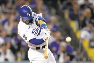  ?? ASHLEY LANDIS/AP ?? The value of versatile utility players such as Chris Taylor, a Virginia Beach native who has played for the Dodgers the past six years, could drop if a metric called Wins Above Replacemen­t (WAR) is used to determine some MLB salaries.