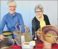  ?? ERIC MCCARTHY/JOURNAL PIONEER ?? Leona Lane, left, and Judy Cotton, two of the volunteers for the Ten Thousand Villages sale the Alberton-Elmsdale UCW hosts annually, display some of the gift items they’ve obtained through previous sales. This year’s sale will be held at the Alberton...