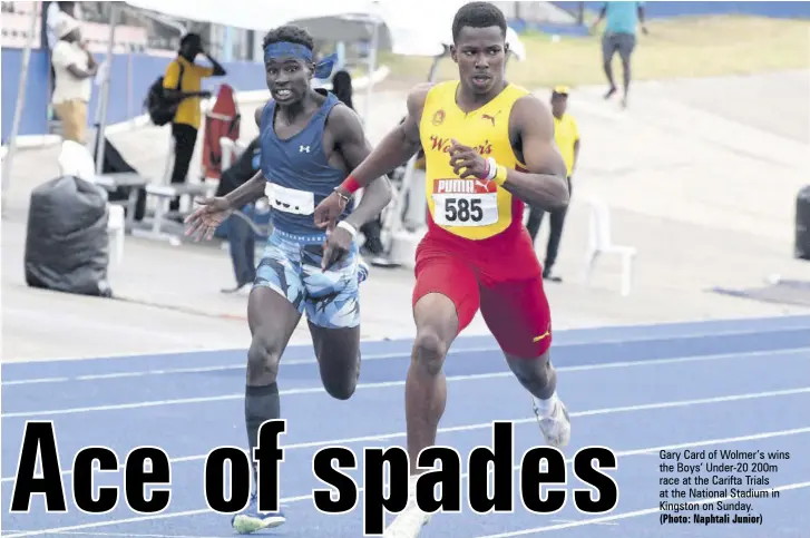  ?? (Photo: Naphtali Junior) ?? Gary Card of Wolmer’s wins the Boys’ Under-20 200m race at the Carifta Trials at the National Stadium in Kingston on Sunday.