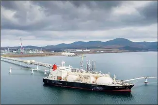  ?? (AP) ?? The tanker Sun Arrows loads its cargo of liquefied natural gas from the Sakhalin-2 project in the port of Prigorodno­ye, Russia, on Friday, Oct. 29, 2021. Japan’s industry minister said Friday, Nov. 4, 2022, that a Japanese consortium has decided to retain its stake in the new Russian operator of the Sakhalin-1 oil and gas project and is set to notify Moscow by the deadline, a move to secure stable energy supply for the resource-scarce country.