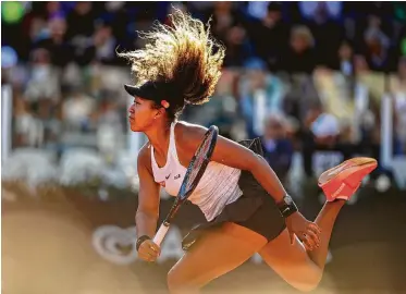  ?? Adam Pretty / Getty Images ?? Naomi Osaka is seeded No. 1 at a major for the first time, and her play on clay has been much better lately. Neverthele­ss, she is is 4-3 at the French Open.