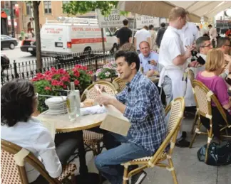  ?? SUN- TIMES FILE PHOTO ?? Mayor Rahm Emanuel is proposing to make Chicago sidewalk restaurant seating legal year- round, instead of the current nine months. Restaurate­urs think it’s a tasty idea.