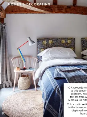  ??  ?? 10 A woven jute mat brings warmth to this converted barn’s guest bedroom, mixing happily with textiles from woollen stripes to Morris & Co Arts and Crafts prints 11 In a rustic setting, there is beauty in the timeworn, with an old sieve displayed to effect against a boarded wall