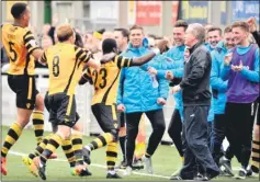  ?? Picture: Steve Terrell ?? Maidstone’s players celebrate scoring the winner against Boreham Wood with the coaching staff