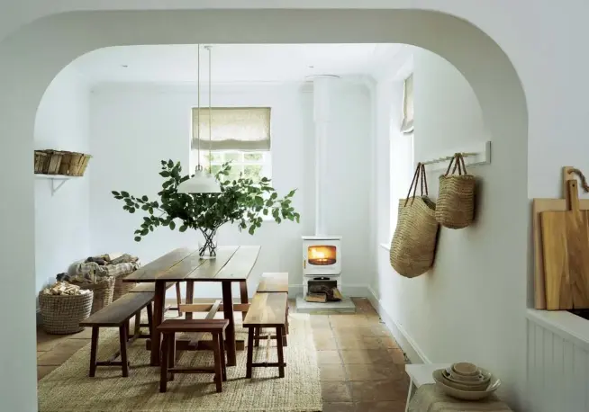  ??  ?? Above The dining area sits beside the open-plan kitchen. A log burner adds a cosy, welcoming feel