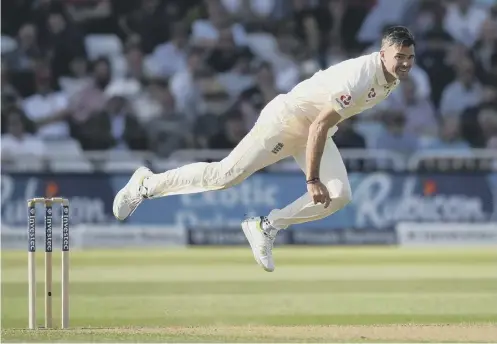  ??  ?? James Anderson in full flight for England, whose attack struggled to make the most of a slow pitch for most of the opening day.