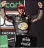  ?? AP ?? Martin Truex Jr. celebrates after winning a NASCAR Cup Series race at Phoenix Raceway Sunday.
