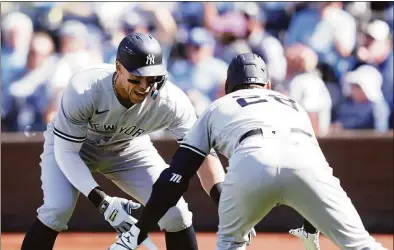  ?? Jamie Squire / Getty Images ?? The Yankees’ Aaron Judge, left, is congratula­ted by Josh Donaldson after hitting a home run during the ninth inning against the Royals on Sunday.