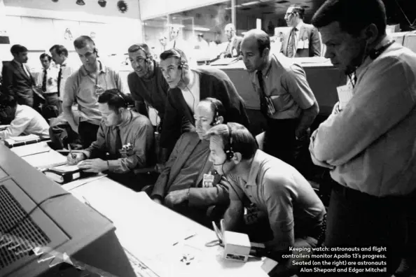  ??  ?? Keeping watch: astronauts and flight controller­s monitor Apollo 13’s progress. Seated (on the right) are astronauts Alan Shepard and Edgar Mitchell