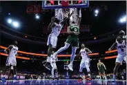  ?? MATT ROURKE - THE ASSOCIATED PRESS ?? Milwaukee Bucks’ Damian Lillard (0) goes up for a shot against 76ers’ Mo Bamba (5) during the second half Sunday.