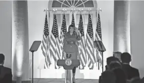  ?? SMIALOWSKI / AFP VIA GETTY IMAGES BRENDAN ?? First lady Melania Trump waves from the Rose Garden of the White House as she addresses the Republican National Convention during its second day.