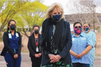  ?? MANDEL NGAN/POOL VIA AP ?? First lady Jill Biden visits a COVID-19 vaccinatio­n center in Fort Defiance, Ariz., on Friday.