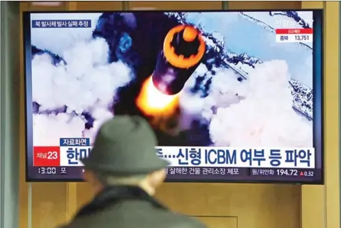  ?? AFP ?? People watch a television screen showing a news broadcast with file footage of a North Korean missile test, at a railway station in Seoul on Wednesday, after North Korea fired an ‘unidentifi­ed projectile’ but appeared to have immediatel­y failed according to the South’s military.
