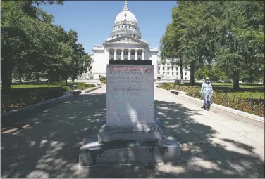  ?? (Wisconsin State Journal/Steve Apps) ?? A pedestal where the statue of famed abolitioni­st Col. Hans Christian Heg stood sits empty outside the State Capitol in Madison, Wis.