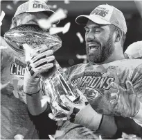  ?? REUTERS/MIKE BLAKE ?? Kansas City Chiefs’ Laurent Duvermay-Tardif celebrates with the Vince Lombardi trophy after winning the Super Bowl LIV.