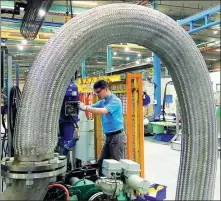  ?? PROVIDED TO CHINA DAILY ?? A technician checks water treatment equipment at a Xylem manufactur­ing facility in China.