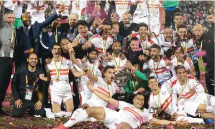  ??  ?? Zamalek players pose with the CAF Super Cup trophy after their win over Tunisia’s Esperance in Doha yesterday. PICTURE: Noushad Thekkayil