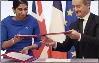  ?? ?? SIGNED UP: Suella Braverman signs deal with French interior minister Gerald Darmanin