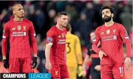  ?? — AFP ?? Liverpool’s Mohamed Salah (right) reacts after their 2-3 Champions League Round of 16 second leg loss to Atletico Madrid at Anfield on Wednesday.