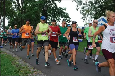  ?? SHEA SINGLEY — MEDIANEWS GROUP ?? More than 100runners take off at the start of the 13th annual Run4Sam four-mile run on Sunday, Aug. 15, at Gring’s Mill Recreation Area.