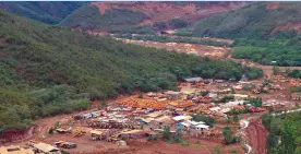  ??  ?? MOUNTAINS destroyed by mining operations loom large from a mining company’s base camp in Surigao del Sur. Mindanao has become the country’s hotspot for murders of land and environmen­tal defenders, accounting for 67% of the total killed in the Philippine­s in 2017 (48 deaths) and a third in 2018, Global Witness pointed out. MindaNews photo by BONG S. SARMIENTO