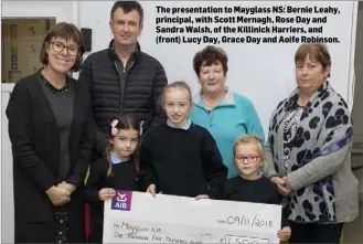  ??  ?? The presentati­on to Mayglass NS: Bernie Leahy, principal, with Scott Mernagh, Rose Day and Sandra Walsh, of the Killinick Harriers, and (front) Lucy Day, Grace Day and Aoife Robinson.