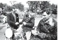  ??  ?? Smiths Industries presented each team member with a wrist watch. Their man, Jack Owens, shakes John Giles hand as he presents the timepiece as Roy Peplow inspects his watch.