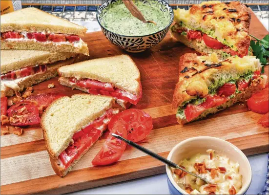  ?? AND PHOTOS BY CHRIS HUNT FOR THE ATLANTA JOURNAL-CONSTITUTI­ON STYLING BY KATE WILLIAMS ?? Tomato Sandwich with Bacon Mayonnaise (upper left), Classic Tomato Sandwich (lower left) and Grilled Tomato and Chimichurr­i Sandwich (right) are three tasty versions of the summertime favorite. Limiting ingredient­s means you don’t run the risk of overcompli­cating and overwhelmi­ng what should be the hero of each sandwich.