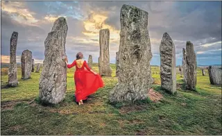  ??  ?? A lady in red at the mysterious Callanish Stones on Lewis
