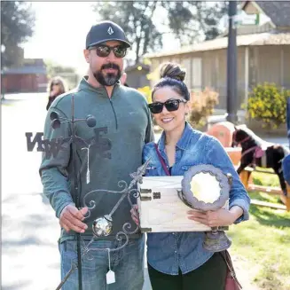  ?? COURTESY OF THE KERN COUNTY MUSEUM ?? Happy attendees pose with their finds at a Village Flea in 2019. The open-air market returns to the grounds of the Kern County Museum on Sunday.