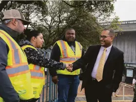  ?? Chloe Aftel / Special to The Chronicle ?? Alaric Degrafinri­ed (right) is leaving Public Works for a new job overseeing human resources, procuremen­t and labor relations at BART.