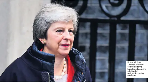  ??  ?? Prime Minister Theresa May was confronted by a hugely embarrasin­g ministeria­l resignatio­n on her doorstep