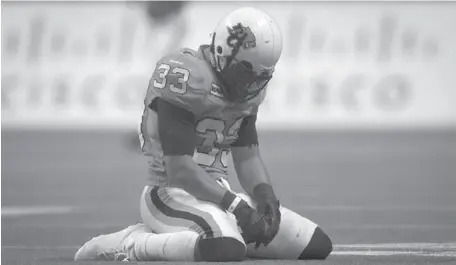  ?? CP PHOTO ?? The B.C. Lions’ Andrew Harris reacts after failing to get a first down against the Calgary Stampeders during the second half of the CFL Western Final football game in Vancouver on Sunday.