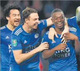  ?? AFP ?? Leicester City's Nampalys Mendy (centre) celebrates after scoring his team's decisive sixth penalty against Southampto­n in the League Cup in Leicester on Tuesday. Leicester won 65 in the shootout.